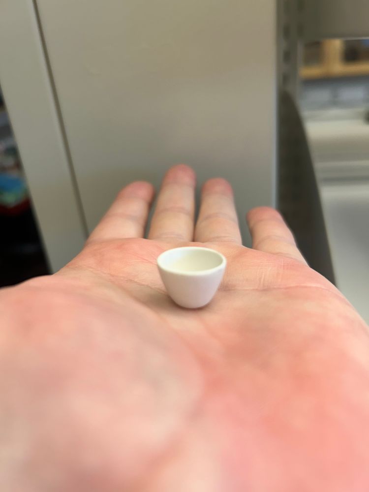 A very tiny crucible occupying only a tiny fraction of the palm of my hand 