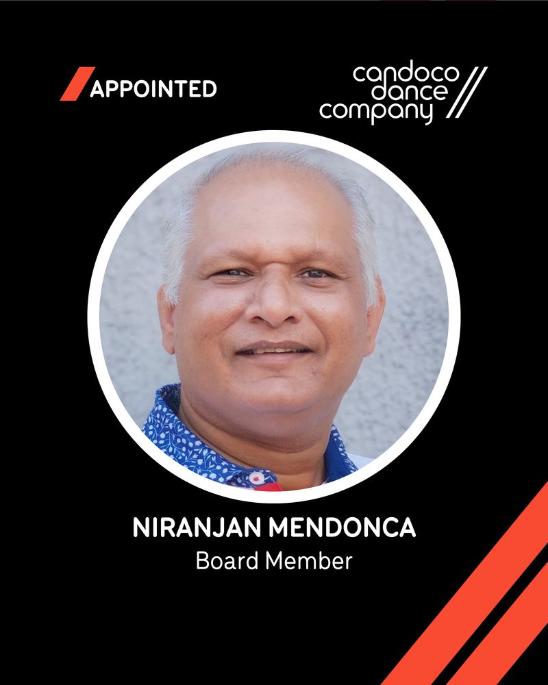A promotional poster announcing Niranjan Mendonca - a new member joining Candoco’s Board. The design features a black background with white text: the word ‘Appointed’ appears in the top left beside a white Candoco logo. Centred in the poster is a circular headshot of Niranjan - A person with short white hair, wearing a white shirt with blue and white patterns, gently smiling at the camera. White text reading "Niranjan Mendonca Board Member" appears at the bottom. Bold orange forward slashes reflect the company’s branding. 