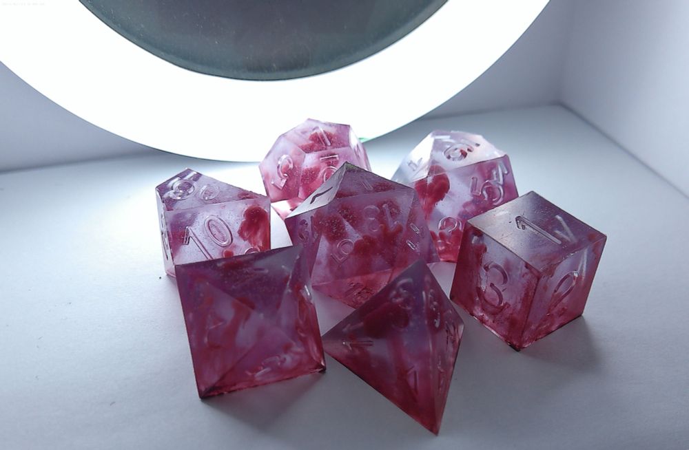 Translucent slightly purple and pink smokey dice 