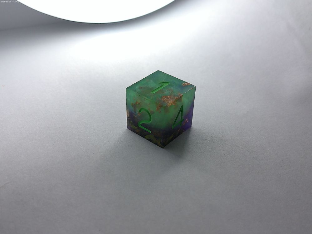 Purple and green dice with gold flakes 