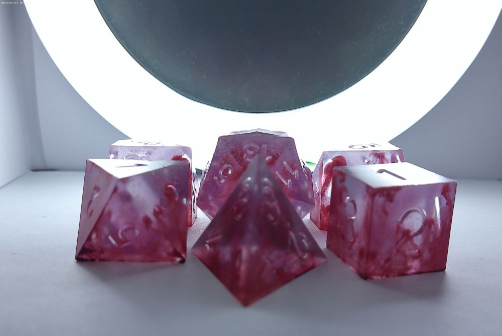 Translucent slightly purple and pink smokey dice 
