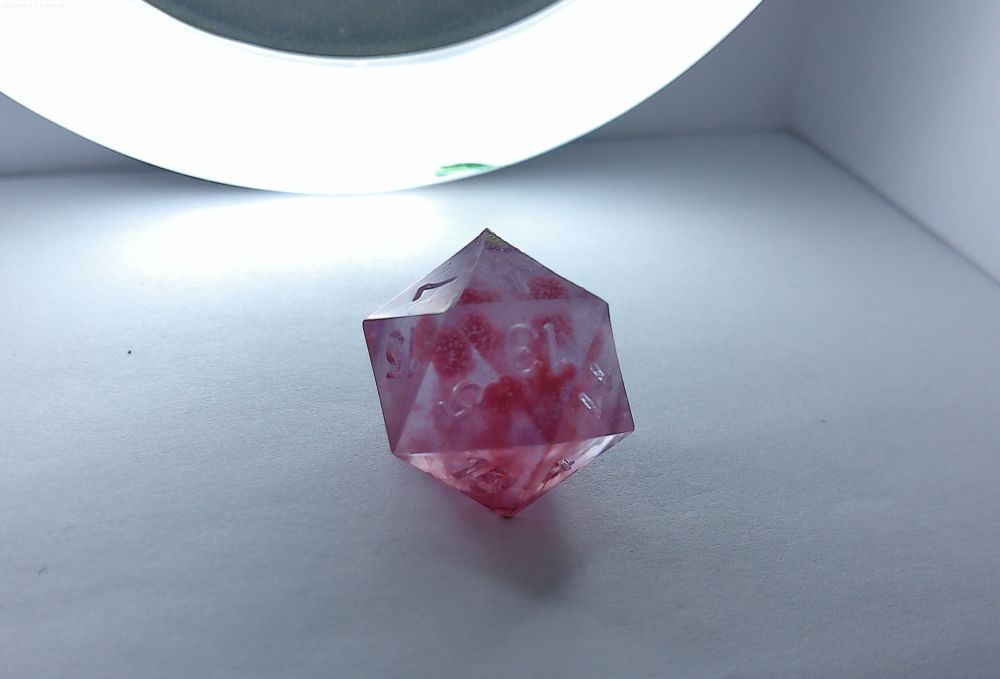 Translucent slightly purple and pink smokey dice 