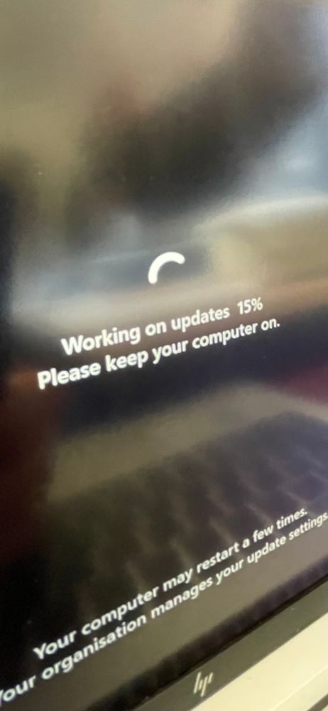 A computer screen saying working on updates 15%