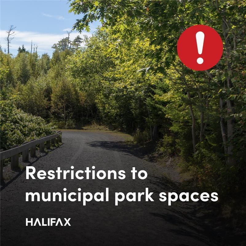A gravel trail lined with trees with text that reads ‘Restrictions to municipal park spaces’. A red circle with an exclamation mark is in the top right corner and the Halifax logo is in the bottom left corner. 