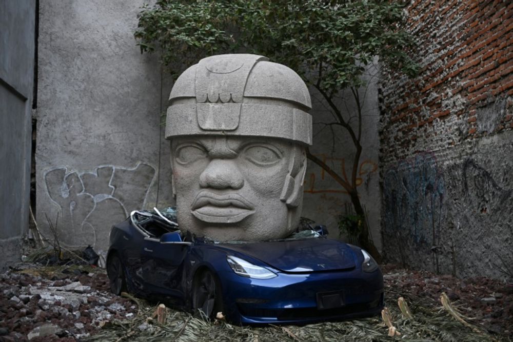 Mexican artist crushes Tesla under giant stone head