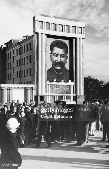 A building with a large portrait of Stalin on it, reflecting the authoritarianism of Trump's ego