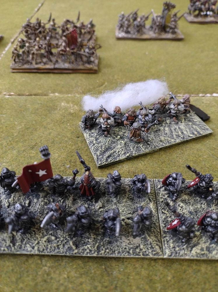 15mm Dwarves advancing towards the undead. Dwarf skirmishers have opened fire with muskets