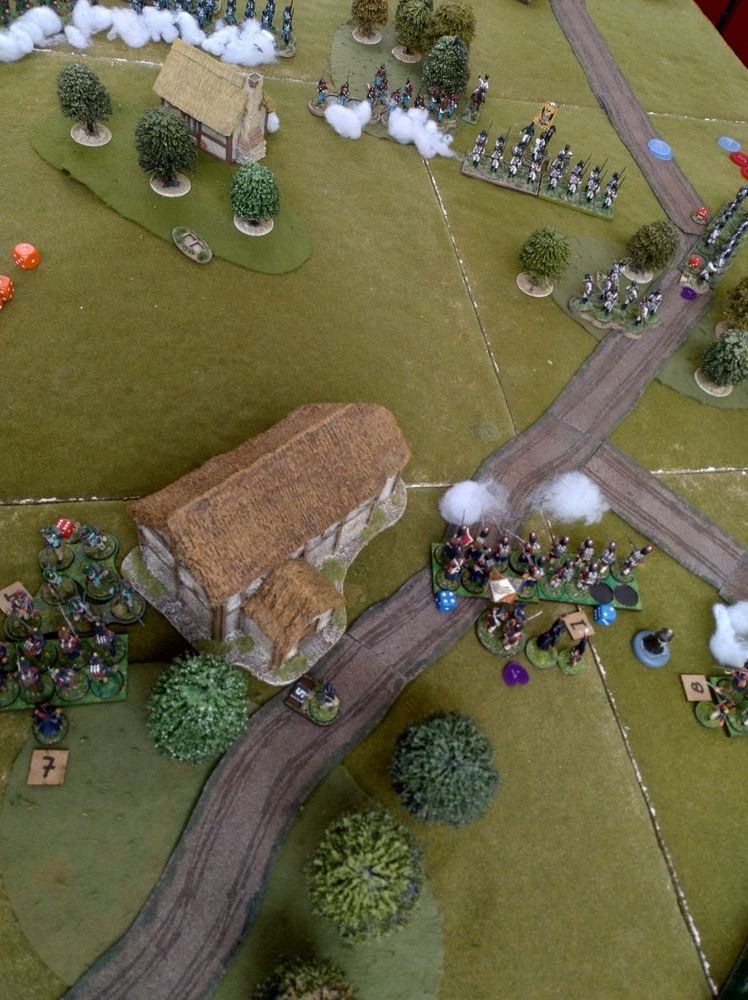 The Grenzer are slowly degrading the Grenadiers whilst a line company advances. In the top left the Landwehr is still blasting away at the now empty cottage