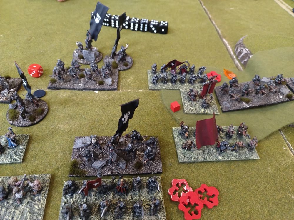 Mutually assured destruction. Dwarves breakthrough the centre and the Uruk-Hai breakthrough in the other direction 