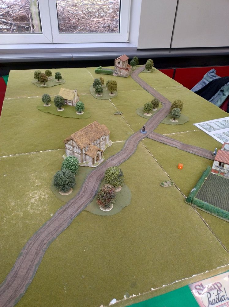 Wargames table looking from the French side at the bottom towards the Austrian deployment points at the top. Peaceful with a single monk out for a stroll 