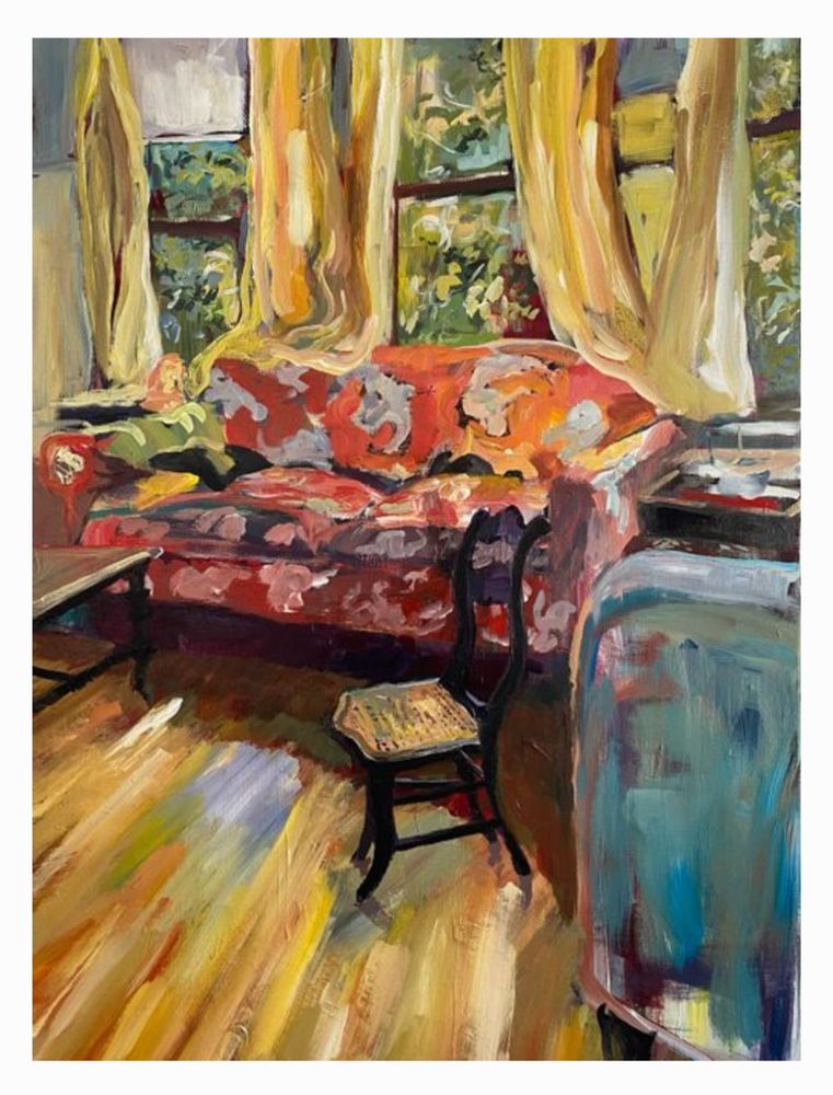 An overstuffed loveseat, with its back to a sunned bay window, faces a coffee table, a dining chair, and hardwood floors basking in morning sunlight. Artist: Mittie Quentara