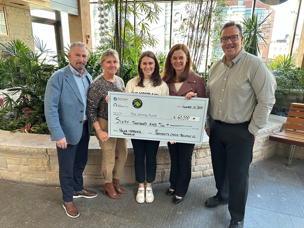 Members of the President's Choice Jimmy Fund Golf Tournament hold up a large check addressed to The Jimmy Fund for $60,000.
