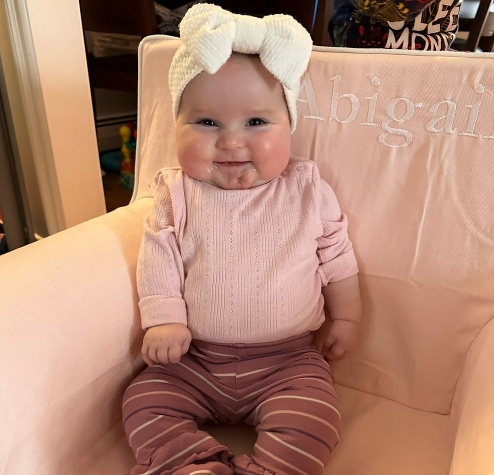 Abby, pictured as a baby, smiles during treatment 
