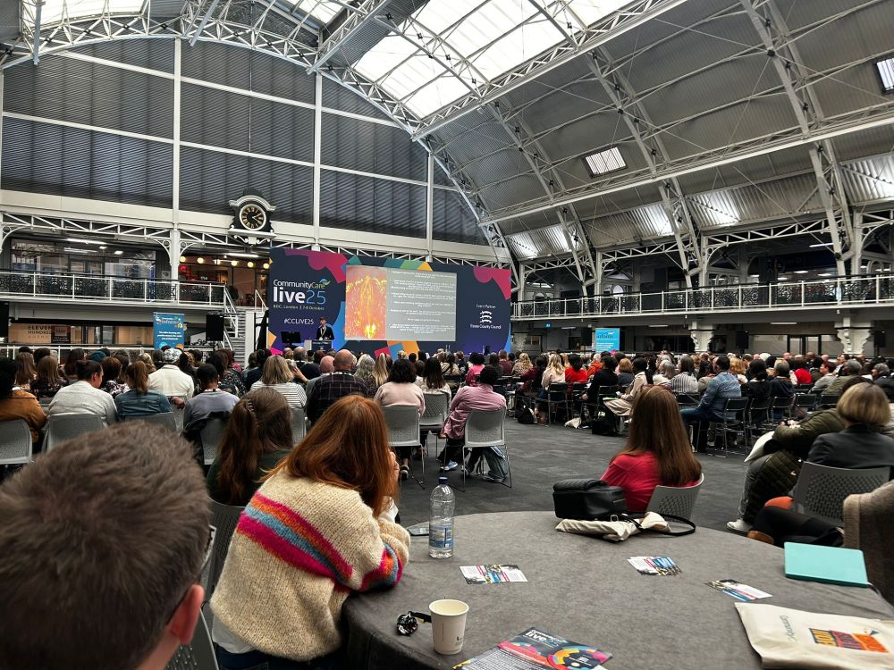 Attendees listen to a discussion at Community Care Live