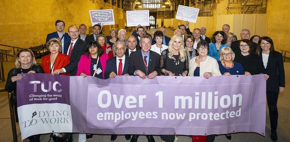 TUC Dying to work campaign. Photo of campaign supporters with banner: Over 1 million employees now protected.