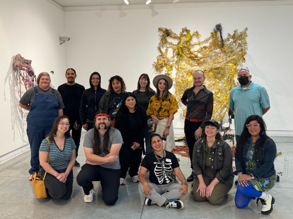 12 people from AGCC with Dakota Noot and Juan Gomez at Gomez's solo show "Within the Chaparral" at the Frank M Doyle Arts Pavilion at Orange Coast College.