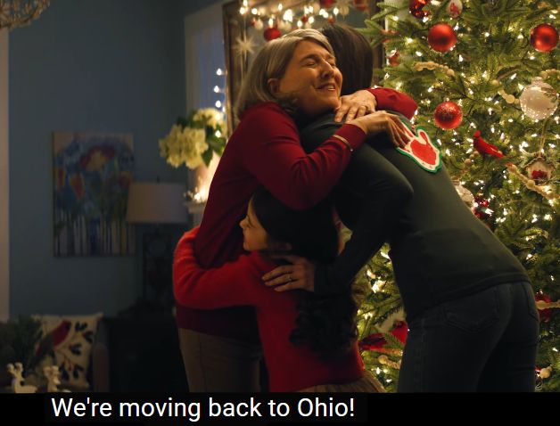 an ohio tourism ad where a girl, her mom, and her grandmother are hugging joyfully after the mother announces they're moving back to ohio. again this is fiction