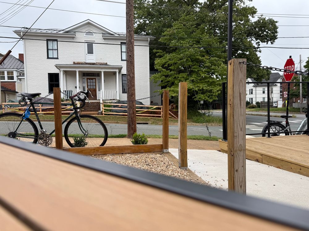 One bike on left. One on right. My yellow ebike to the left, not pictured.4th bike up street locked up to sign post. 
