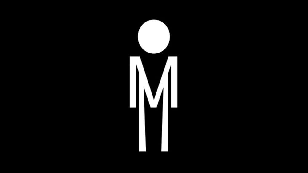 Black background with minimalist white graphic of a human figure — the figure’s body is stylized as a capital letter “M” with straight vertical lines for legs and a circle for a head.