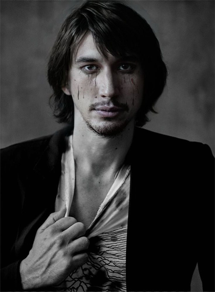 Mascara run and dead / cursed looking man grabbing his own shirt 