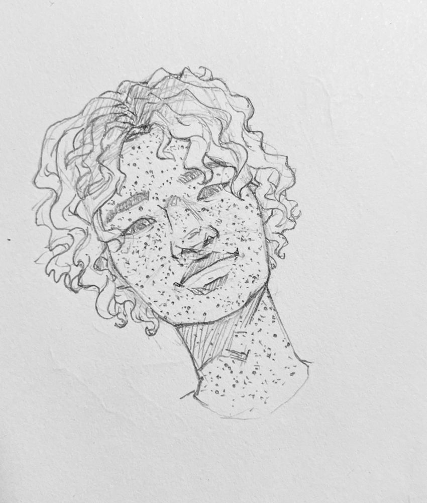 A headshot doodle of Gabriel Vasquez, a freckled Filipino with broad lips, a wide jaw and nose, and soft eyes with just a little mischievous tension in his brow. Its hair is curly and short, down to just the chin. 