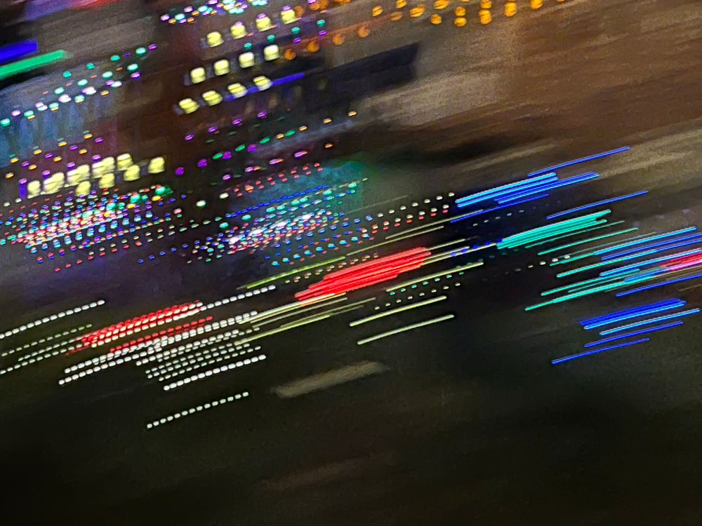 Streaks of light crossing the screen in a quick blurred motion.