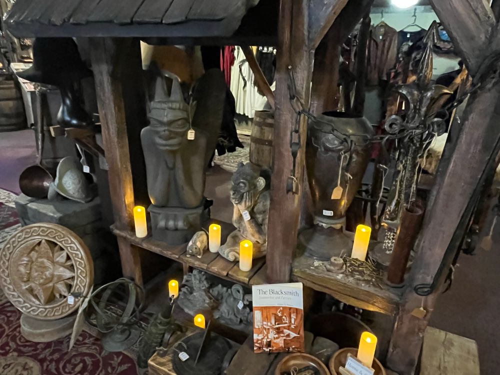An assortment of statues and candles.