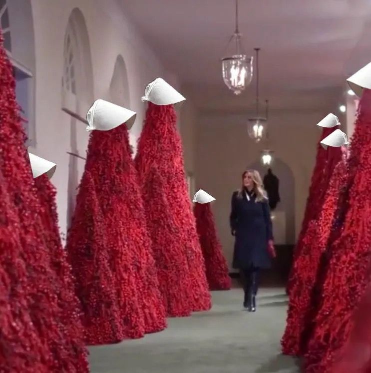 The red Christmas trees that melania decorated the WH with but with handmaids tale hats on top of them