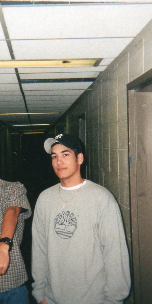 A total doofus standing in a San Diego State dorm hallway.