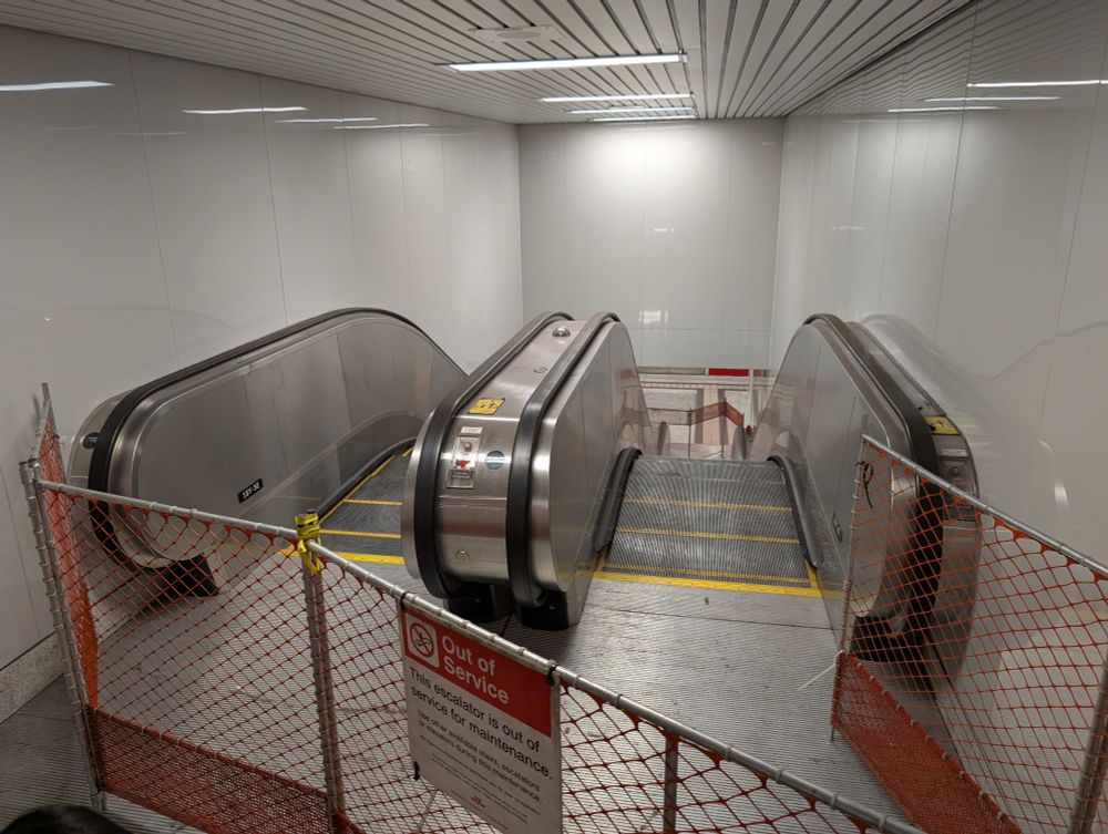 A out-of-service set of escalators from the concourse level to the Line 1 subway platform
