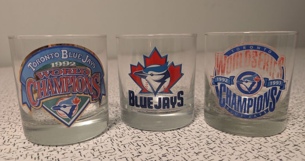 A set of three commemorative glasses:
1) Blue Jays with logo
2) Blue Jays 1992 World Champions
2) Blue Jays 1992-1993 World Series Champions