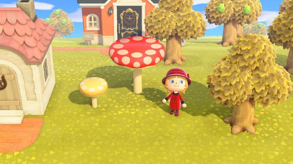 Lilica standing with some Mario-themed mushroom props set up for the Fall