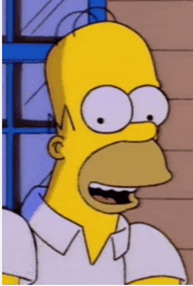 Homer Simpson sonriendo con una felicidad inusitada.