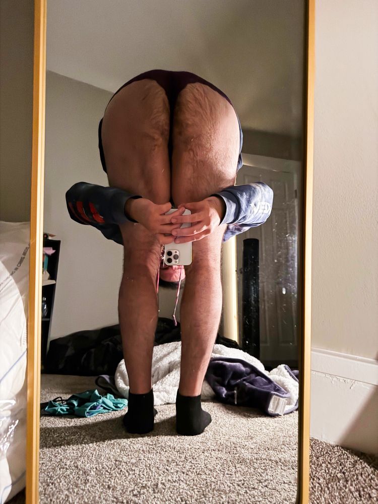 Ghost bent over practically in half at the waist, taking an upside down picture of the lacy panties showing full ass 