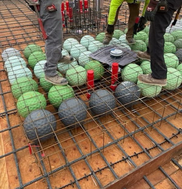 A grid of rebar with plastic “voids” within it to create a “bubble deck” which is a concrete deck with less weight. 