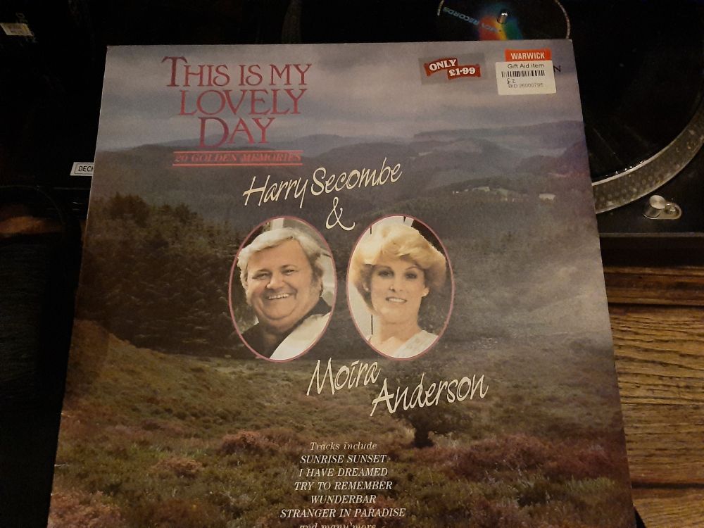 The cover of the vinyl LP THIS Is My Lovely Day sung by Harry Secombe & Moira Anderson. A sticker says ONLY £1.99 which is probably an absolute bsrgain