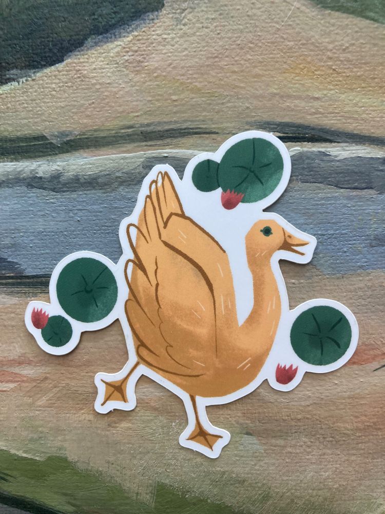 sticker of a yellow goose surrounded by lily pads