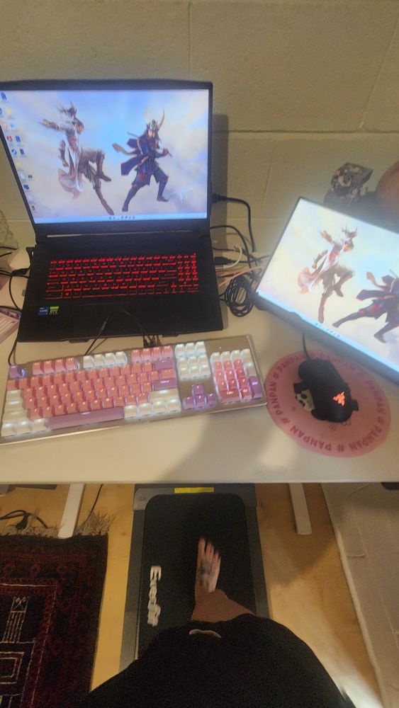 Stand up desk with a walking pad. 