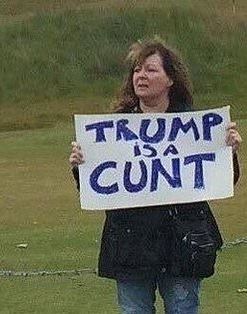 Janey Godley holding up her famous Trump is a cunt sign 