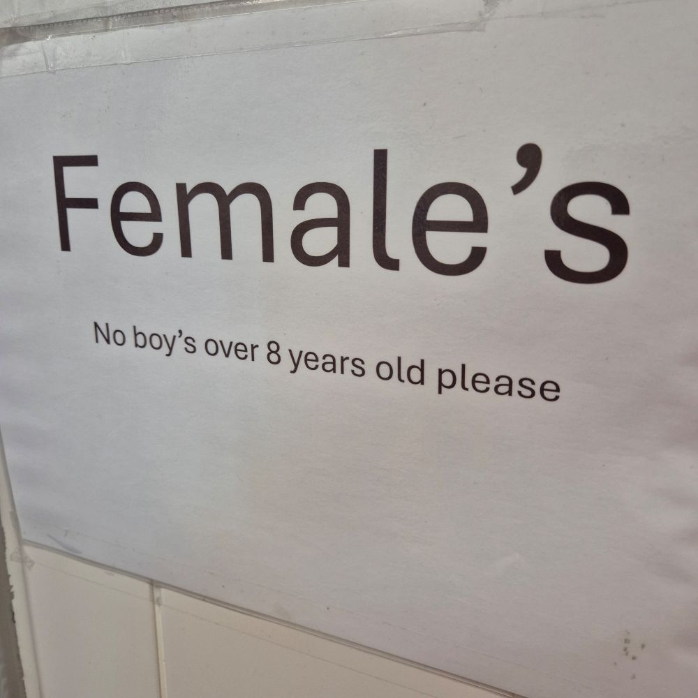 Simple word processed sign that reads "Female's" in large writing, underneath having "No boy's over 8 years old please".
