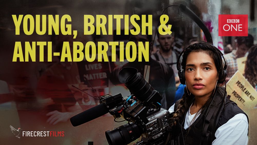 Director Poppy Jay holding a camera as she films at an anti-abortion rally 