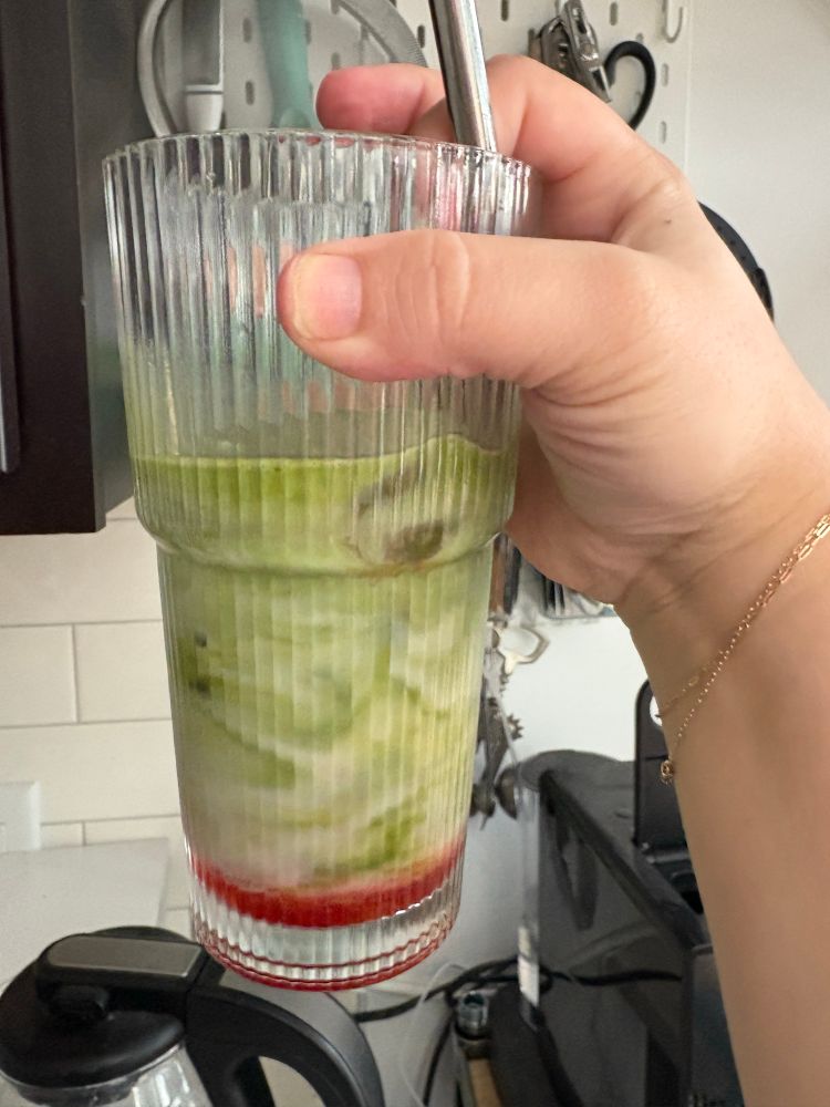 an iced matcha with homemade strawberry syrup 