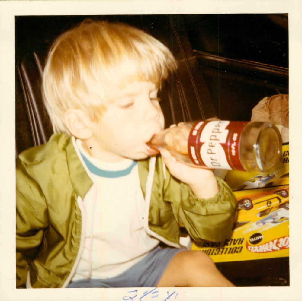 Me as a little tyke, sucking down some Dr. Pepper 