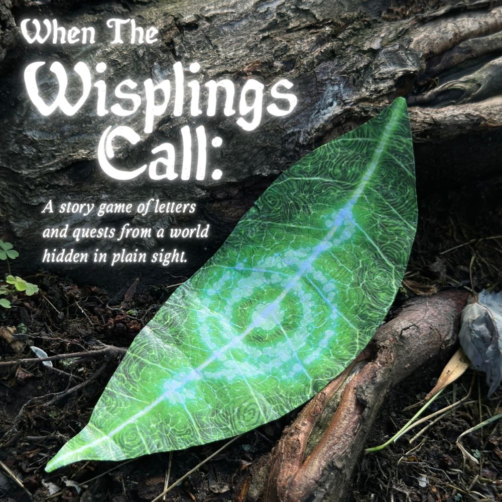 A large green leaf with spiral vein patterns lies on the forest floor next to roots. Text reads: “When The Wisplings Call: A story game of letters and quests from a world hidden in plain sight.”