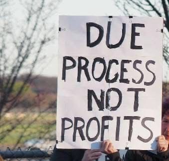 Protest sign that says “DUE PROCESS NOT PROFITS”