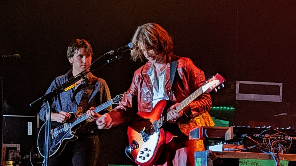 Shane and Tyler Fogerty on stage.