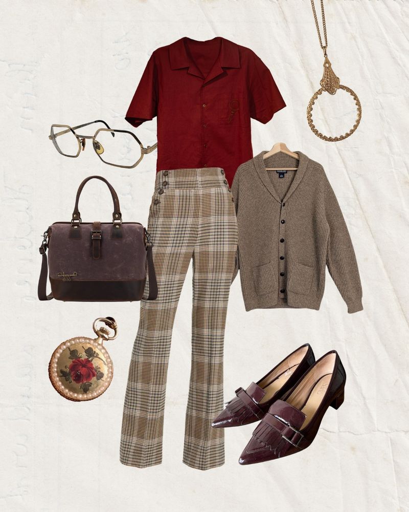 We heard ‘cottage core librarian’ plus our Classics camp shirt in wine and our minds went in a cherry pie direction. Pairing the short sleeved button up with thrifted tan and white high waisted plaid pants, a cozy beige cardigan, and tassel loafer-inspired kitten heels in a rich dark red leather. Matching the shoes to a leather messenger bag and vintage accessories like a rose and pearl-adorned pocket watch, magnifying glass pendant, and gold geometric glasses.