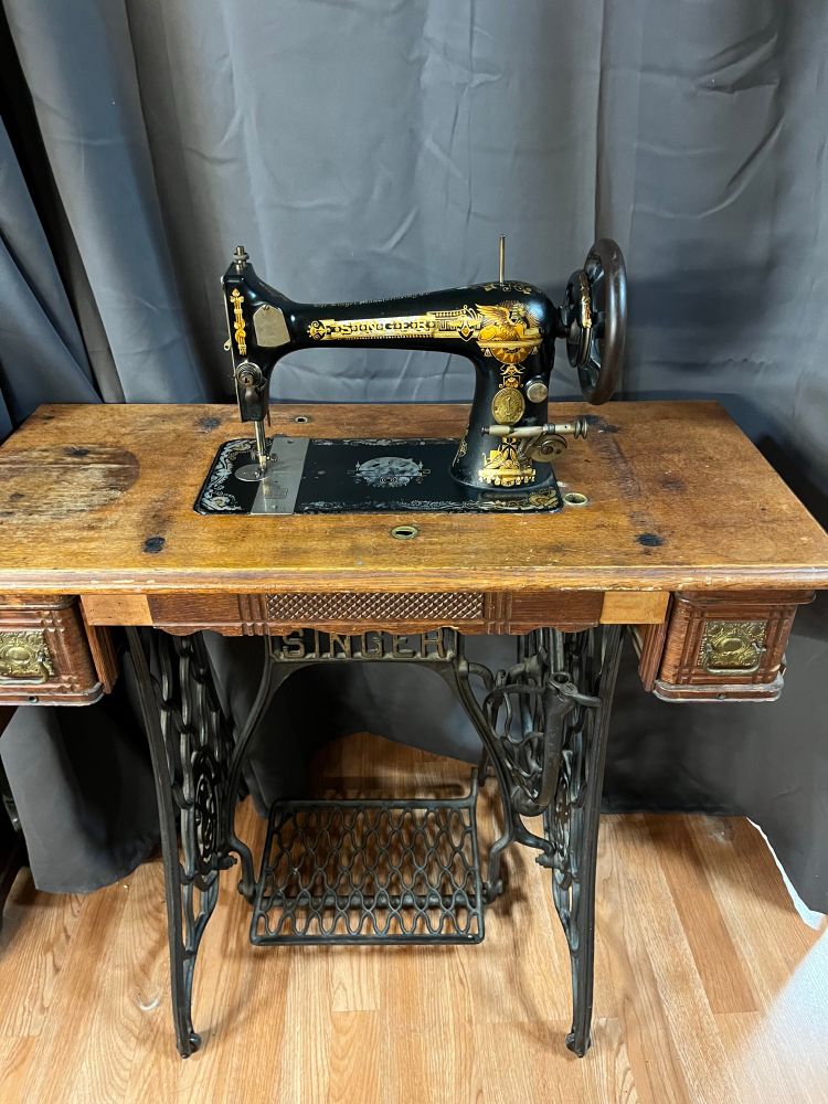 Singer sewing machine with treadle