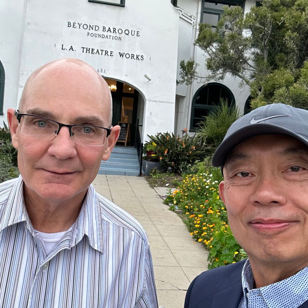 Photo of David and his partner at Beyond Baroque in Los Angeles.