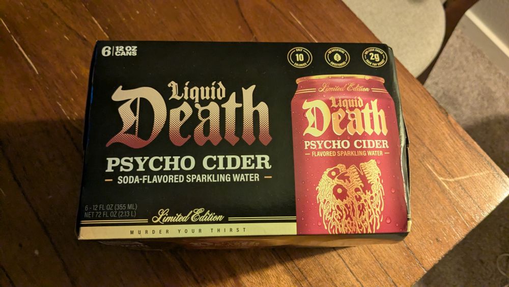 Side profile of a 6 pack of Liquid Death's seasonal flavor "Psycho Cider" 